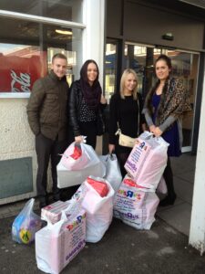 Taxi Cab Insurance Team deliver Christmas presents to local children's hospital