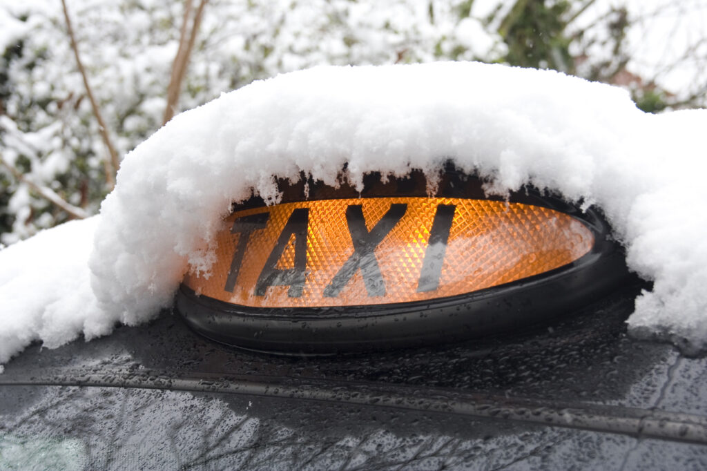 Taxi Covered in Snow